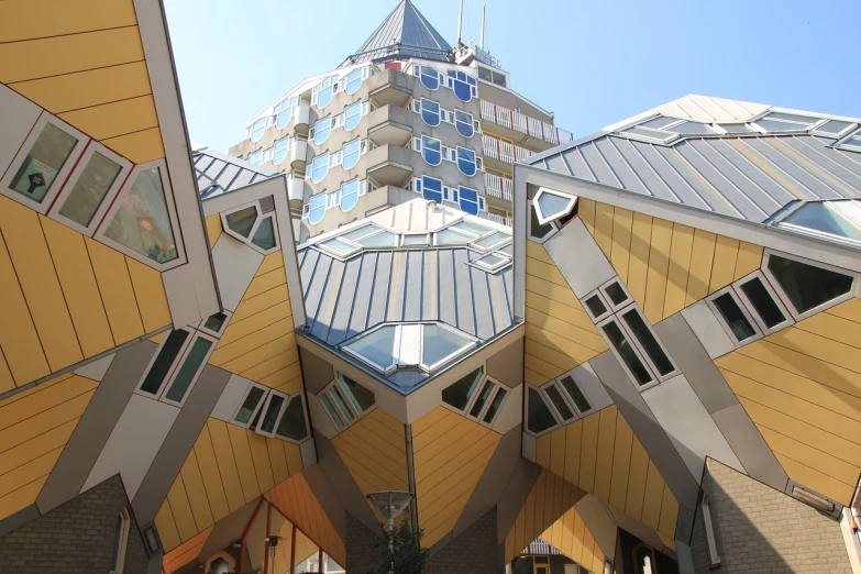 a couple of buildings that are next to each other, inspired by Hans Mertens, flickr, cubo-futurism, is a stunning, roofs, seen from outside, dutch angle