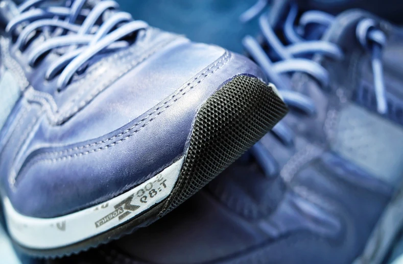 a close up of a pair of blue shoes, a macro photograph, soft rubber, mesh, highly detailed product photo, foot path