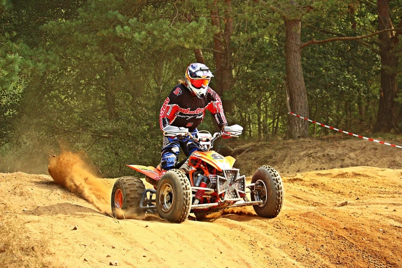 a man riding on the back of a dirt bike, a photo, all terrain vehicle race, max verstappen, hdr photo, dsrl photo