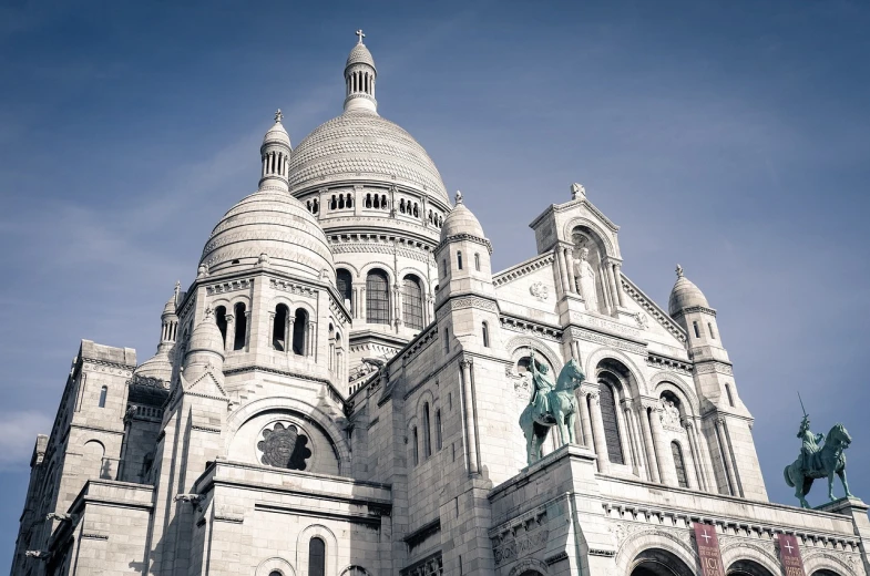 a large building with a statue on top of it, a photo, by Henri Bellechose, shutterstock, background basilica! sacre coeur, fine details, postprocessed, half - length photo