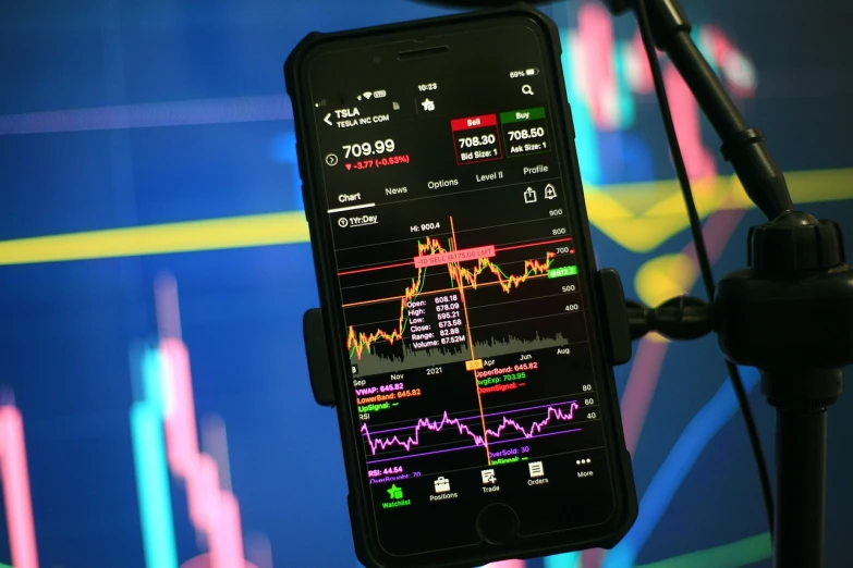 a cell phone sitting in front of a microphone, a picture, figuration libre, displaying stock charts, darkmode, usa-sep 20, manila