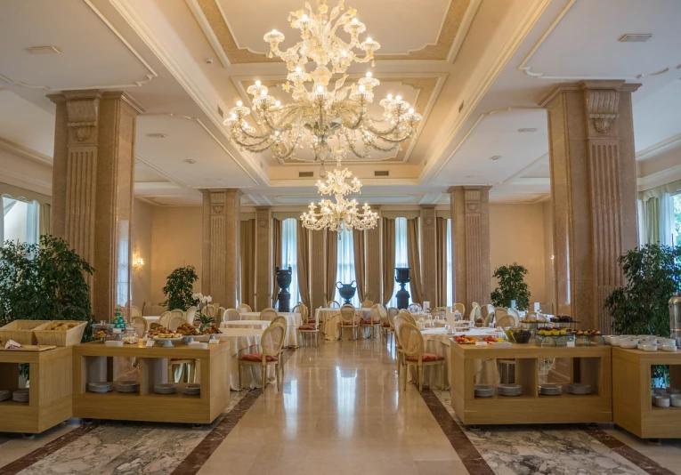 a dining room filled with lots of tables and chairs, by Alfredo Volpi, shutterstock, inside a grand, estefania villegas burgos, breakfast buffet, chandeliers