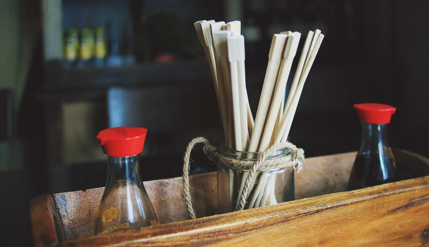 a wooden box filled with bottles and straws, pexels, chopsticks, ivory, fresh atmosphere, genius