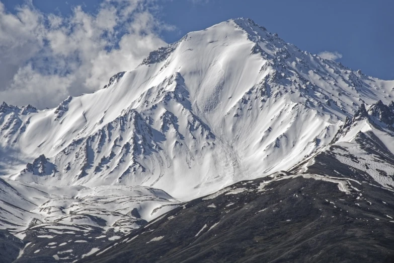 a large mountain covered in snow under a blue sky, by Andrei Kolkoutine, flickr, hurufiyya, vladimir abat-cherkasov, hdr detail, 4k —height 1024 —width 1024, high collar