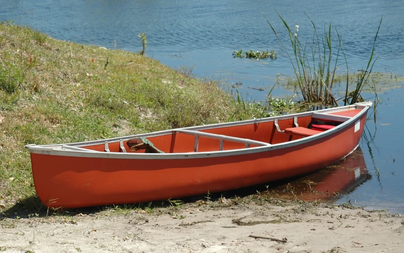 a red canoe sitting on the shore of a lake, a portrait, by Joe Stefanelli, flickr, dau-al-set, side front view, florida, prototype, panoramic shot