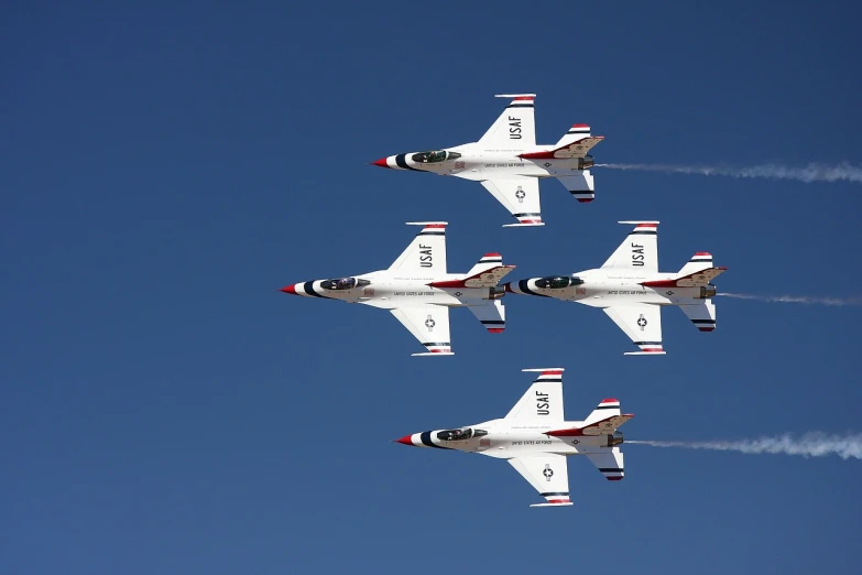 a group of fighter jets flying through a blue sky, by Dennis Ashbaugh, flickr, thunderbirds, white uniform, new mexico, four