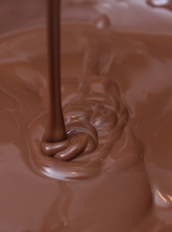 a close up of chocolate being poured into a bowl, a picture, highly detailed product photo, high res photo, in 4k, mid shot photo