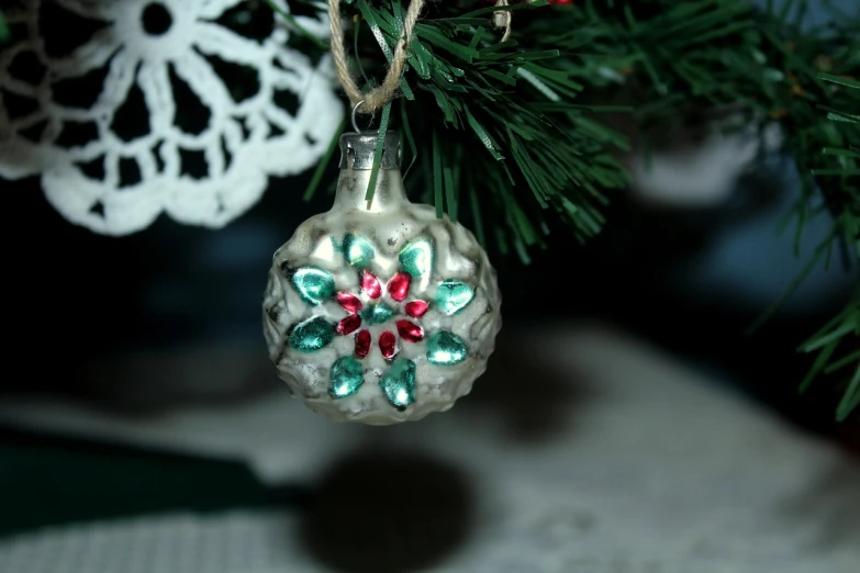 a christmas ornament hanging from a christmas tree, by Maksimilijan Vanka, flickr, folk art, flower, 2 4 mm iso 8 0 0 color, vintage - w 1 0 2 4, glazed