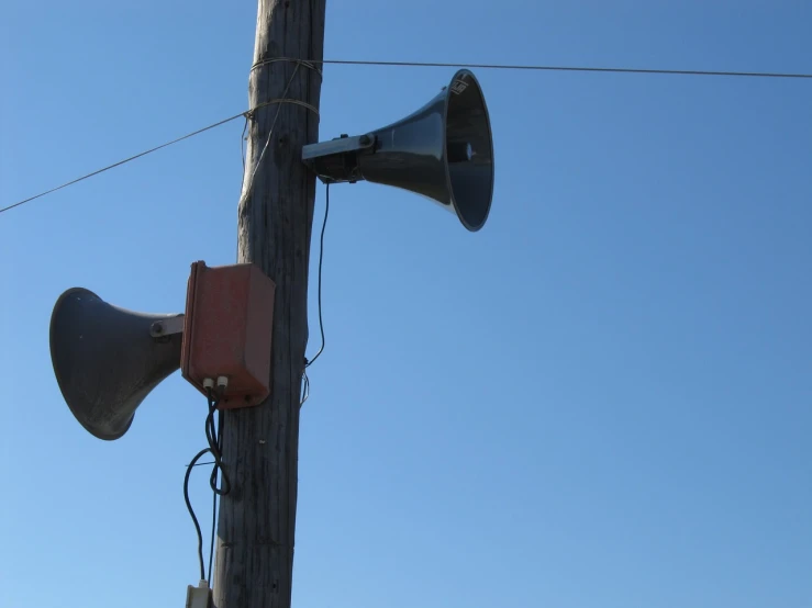 a close up of a speaker on a telephone pole, large and in charge, horn, hero shot, authoritative