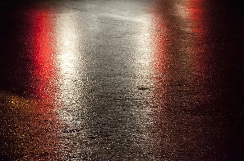 a wet street at night with red and white lights, a picture, shutterstock, realism, abstract texture, wet asphalt, stock photo