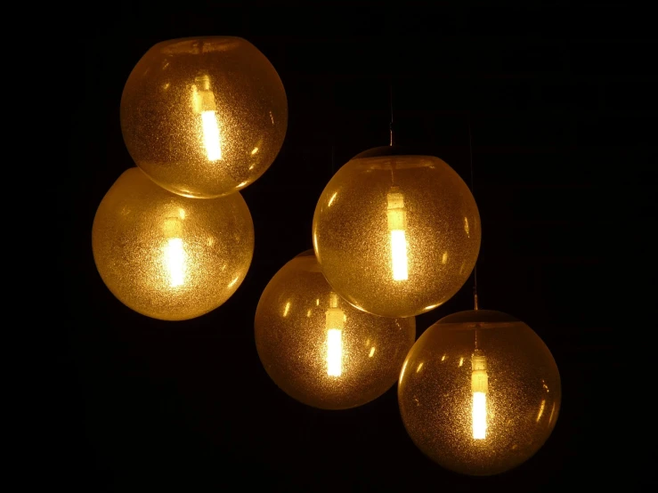 a group of three lights hanging from a ceiling, a stipple, inspired by Bruce Munro, flickr, gold dappled lighting, dramatic lighting !n-9, molten, lemonlight