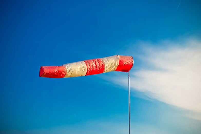 a red and white kite flying in a blue sky, a stock photo, big long cloth on the wind, lantern, closeup photo, very accurate photo