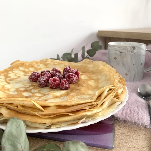 a stack of pancakes with raspberries on top of them, a picture, inspired by Maksimilijan Vanka, romanticism, folded, beautiful morning, frosted, taken in 2 0 2 0