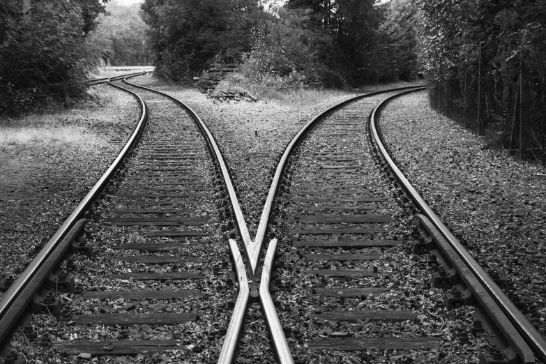 a black and white photo of two train tracks, by Matt Stewart, flickr, precisionism, showing curves, vertical symmetry, confusing optical illusion, b&w!