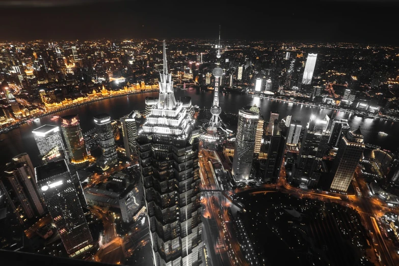 an aerial view of a city at night, by Zha Shibiao, pexels, istock, monochrome, shanghai city, view from high