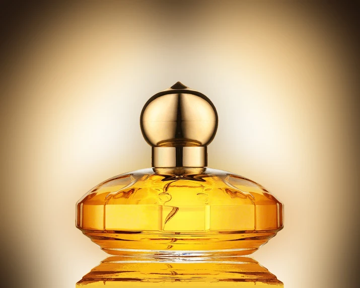 a bottle of perfume sitting on top of a table, a digital rendering, by Dietmar Damerau, shutterstock, art nouveau, warm golden backlit, close-up product photo, glossy yellow, christopher morris photography