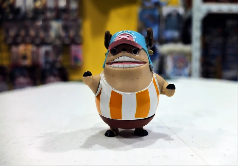 a close up of a toy figure on a table, inspired by Eiichiro Oda, pudgy, one piece ship sailing, beefy, video game dunkey