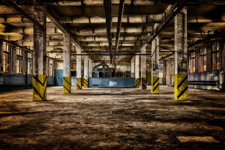 an empty industrial building with lots of windows, by Andrew Domachowski, flickr, graffiti, yellow carpeted, bussiere rutkowski andreas rocha, industrial party, concrete pillars