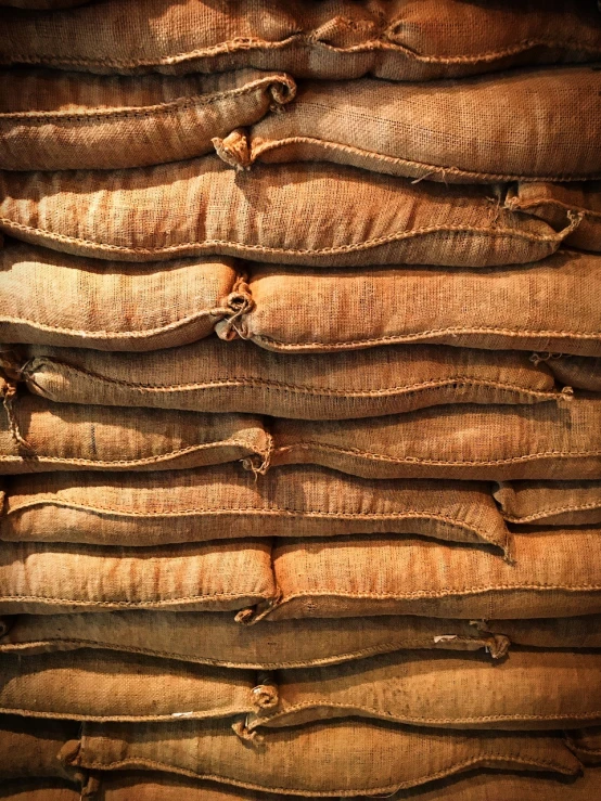 a pile of sand bags stacked on top of each other, pexels, art nouveau, sanjulian. detailed texture, walnut wood, belgium, chocolate