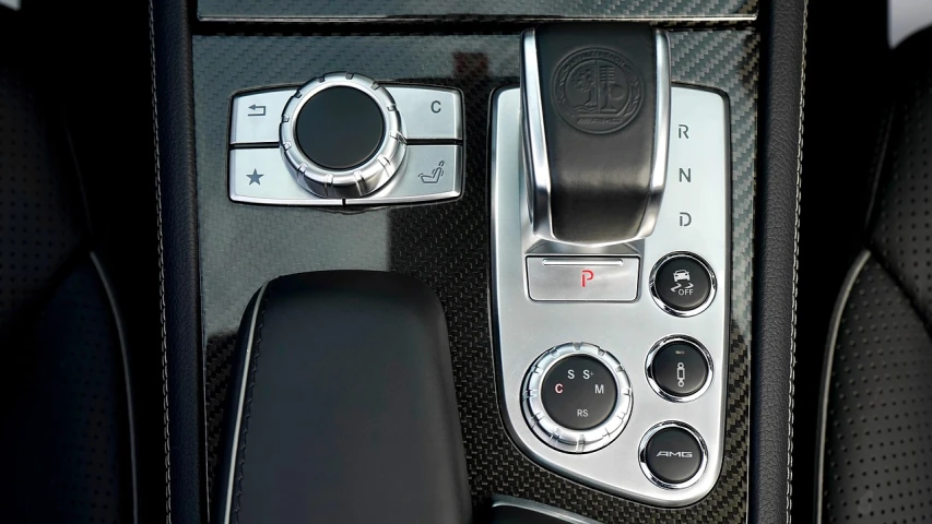 a close up of the center console of a car, a photo, by Randy Post, mercedes, charcoal and silver color scheme, controller, slr