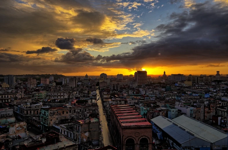 a view of a city from the top of a building, by Alexander Robertson, flickr, cuba, dramatic sunset, ffffound, tekkonkinkreet