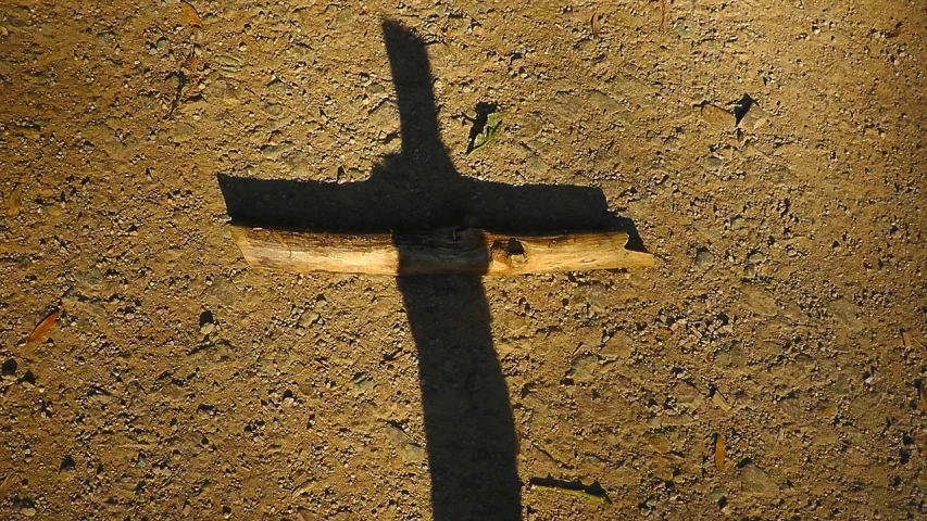 the shadow of a cross on the ground, by Jan Rustem, symbolism, with a wooden stuff, wikimedia, glorious sunlight, bone