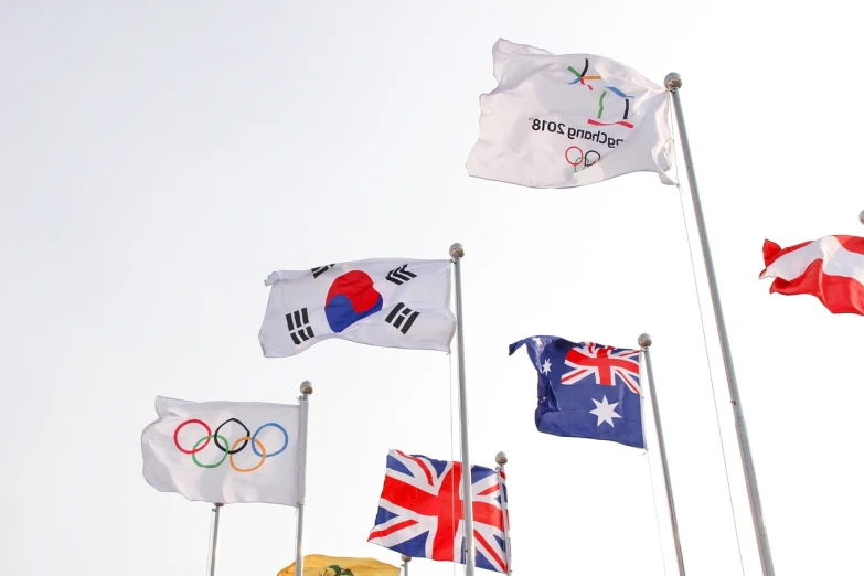 a bunch of flags that are flying in the air, a picture, by Simon Gaon, shutterstock, the olympics footage, kim jung-gi, andy park, australia