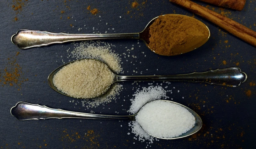 three spoons filled with different types of sugar, a portrait, by Julian Allen, pexels, renaissance, cinnamon, 💣 💥, jamaica, recipe