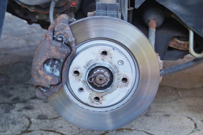 a close up of a brake on a motorcycle, a portrait, fault, rondel, car shot, very accurate photo