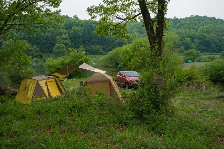 a red truck parked next to a yellow tent, renaissance, lake setting, hong soonsang, - 8, camping