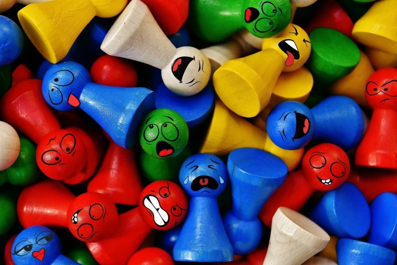 a pile of wooden toys with faces on them, a picture, flickr, yelling, colorful hd picure, marbles, comicbook