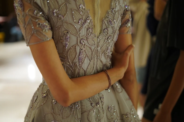 a close up of a dress on a mannequin mannequin mannequin mannequin mannequin mannequin manne, by Eva Gonzalès, tumblr, arabesque, elegant up to the elbow, hugging, fashion week backstage, photograph credit: ap