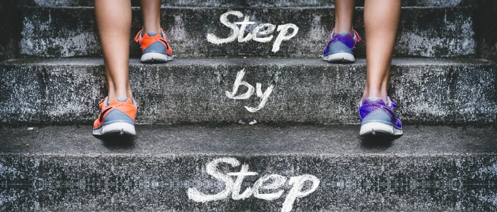 a person walking up a set of stairs with the words step by step written on the steps, by Matija Jama, shutterstock, graffiti, fitness, whole shoe is in picture, rich texture, register