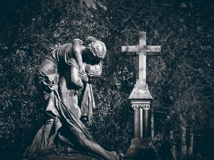 a black and white photo of a statue and a cross, a statue, by Mirko Rački, gothic art, hugs, somber colors, tomb, anton fedeev