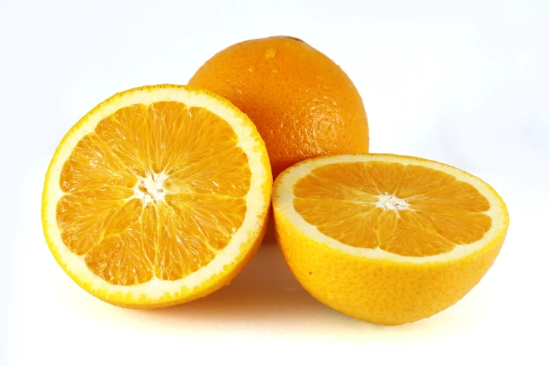 three oranges cut in half on a white surface, a picture, yellow aureole, agent orange, excellent detail, humongous