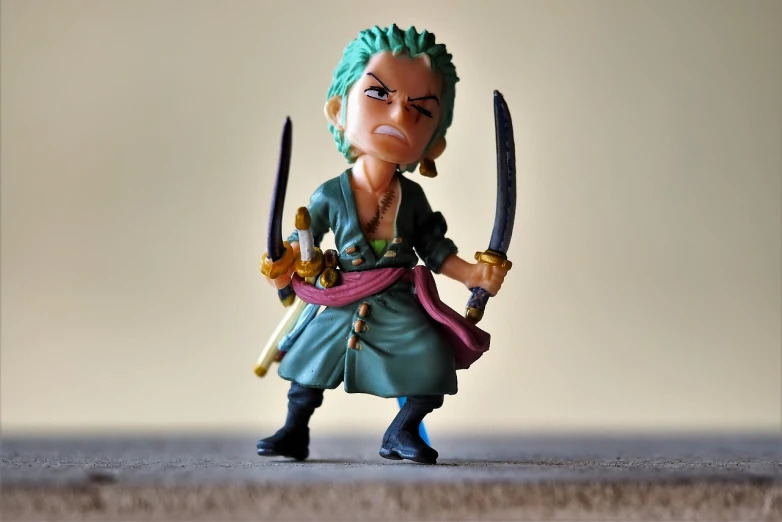 a close up of a figurine of a person holding two swords, a picture, inspired by Eiichiro Oda, pexels, figuration libre, little angry girl with blue hair, roronoa zoro, pvc figurine, gif