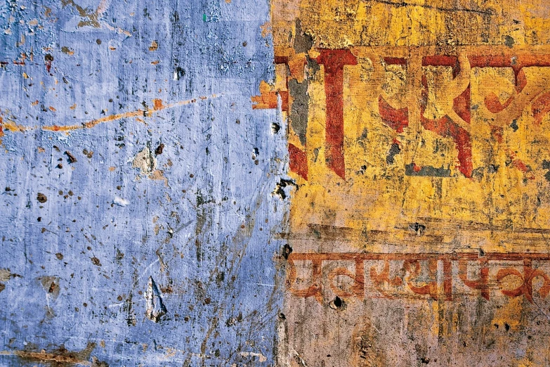 a sign that is on the side of a building, by Mordecai Ardon, flickr, lyrical abstraction, india, high resolution textures, glossy old advertising poster, prussian blue and raw sienna