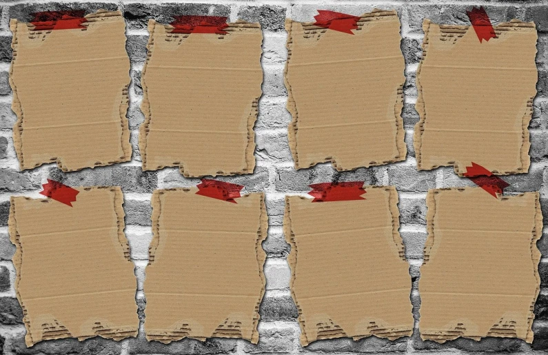 several pieces of cardboard taped to a brick wall, a screenshot, trending on pixabay, conceptual art, stock photo, textured parchment background, concept photo