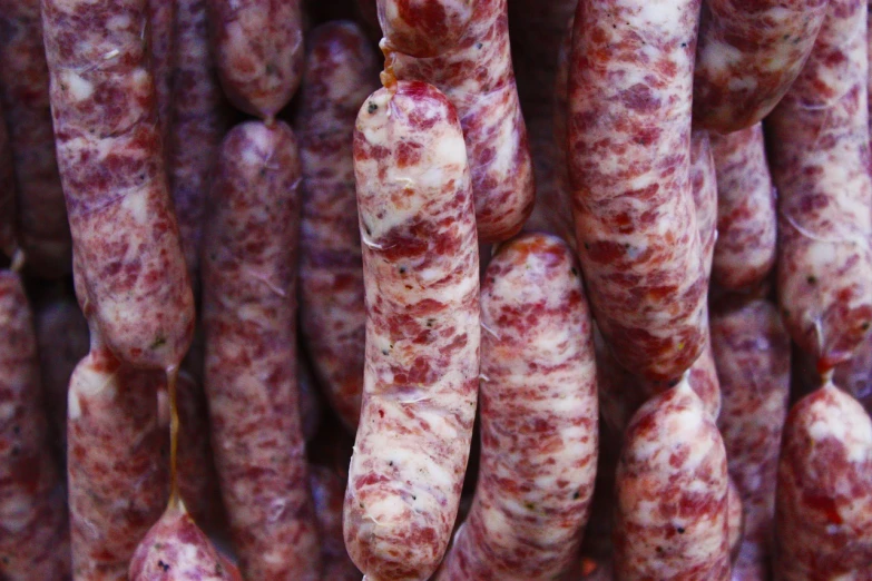 a bunch of sausage hanging from the ceiling, a portrait, by Emiliano Di Cavalcanti, pexels, renaissance, thin red veins, grain”, clover, [ closeup ]!!