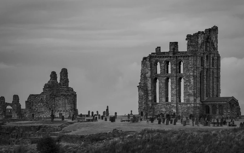 a black and white photo of the ruins of a church, by Robin Guthrie, pexels contest winner, romanesque, marsden, explorers of the ruins at dusk, 4k greyscale hd photography, on the coast