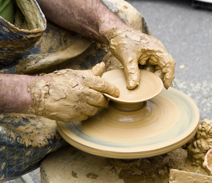 a close up of a person making a bowl on a potter's wheel, by Edward Corbett, flickr, process art, istockphoto, construction, 872637744, plate