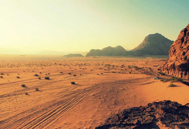 a dirt road in the middle of a desert, shutterstock, hurufiyya, landscape with red mountains, retro effect, wadi rum, high quality screenshot