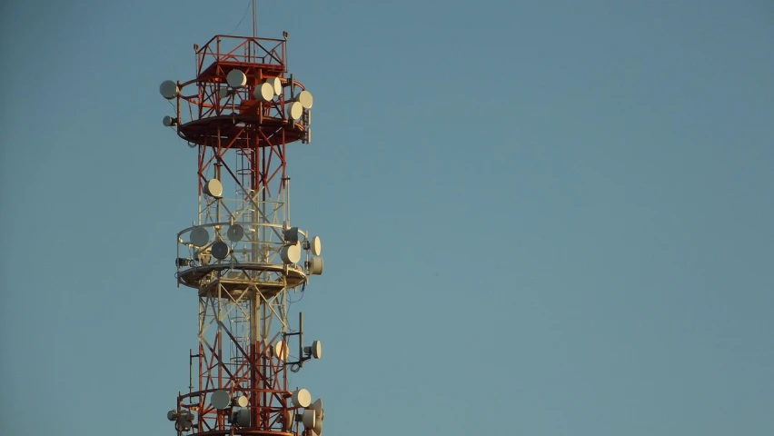 a tower with several cell phones on top of it, pexels, modernism, large antennae, 2 0 0 mm telephoto, super - detailed, television still