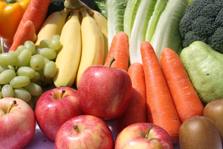 a table topped with assorted fruits and vegetables, a picture, by Edward Corbett, pexels, organic detail, carrots, apple, 3 colour