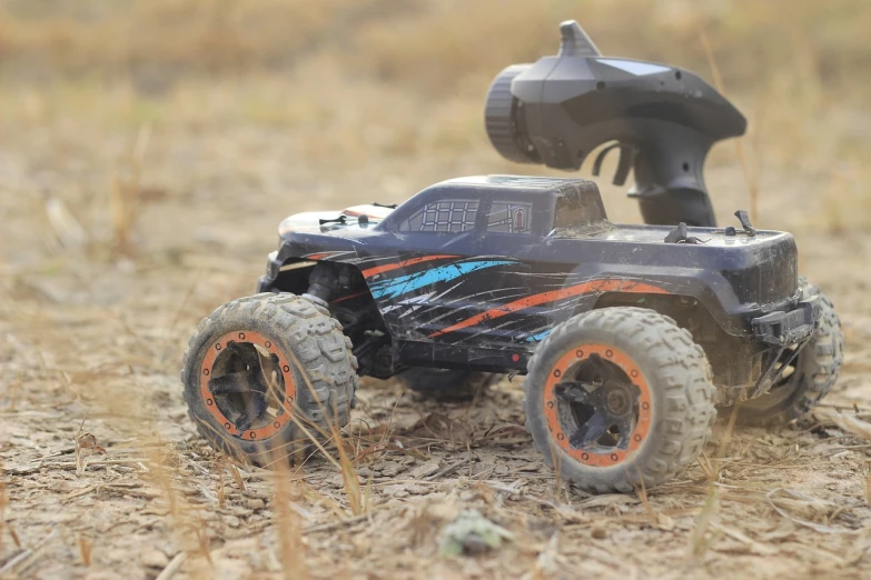 a toy truck that is sitting in the dirt, a portrait, high speed action, h 7 0 4, product introduction photos, fpv