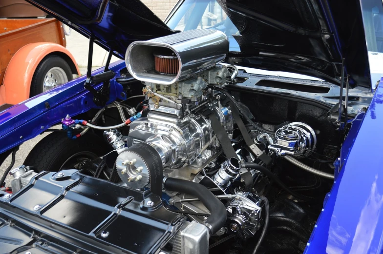 a close up of the engine of a car, shutterstock, muscle cars, with big chrome tubes, high octane filter, stock photo