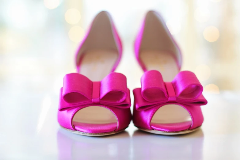 a pair of pink shoes sitting on top of a table, pexels, thick bow, rich deep pink, avatar image, bride