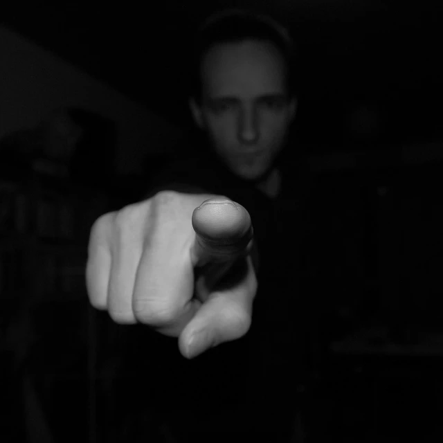 a black and white photo of a man pointing at the camera, flickr, grasp of darkness!!!, looks like jerma985, markus vogt, myself