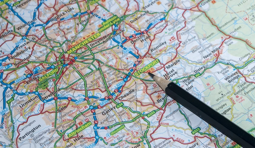 a map with a pencil on top of it, a photo, by Richard Carline, shutterstock, happening, midlands, high detailed close up of, detailed information, roads