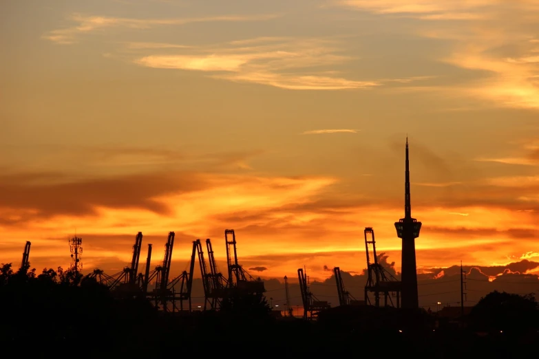 a sunset view of a roller coaster coaster coaster coaster coaster coaster coaster coaster coaster coaster coaster coaster coaster coaster coaster coaster coaster coaster coaster coaster coaster coaster, by Thomas Häfner, shutterstock, hurufiyya, shipping docks, city background in silhouette, hannover, taken with a pentax1000